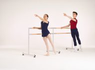 Dancers - 2 x 4ft ballet barres 1 Young female and male ballet dancers practicing arm extensions at two connected portable barres.